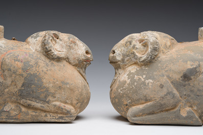 A pair of Chinese polychrome painted pottery ram-shaped vessels, Han dynasty