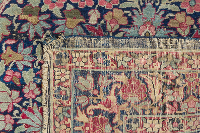 Two Persian rugs with floral design, Kashan and Kerman (Kirman), wool on cotton, 20th C.
