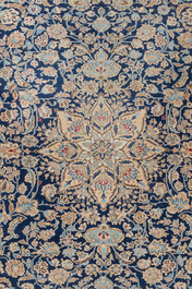 A Persian Nain rug with floral design, wool on cotton, 20th C.