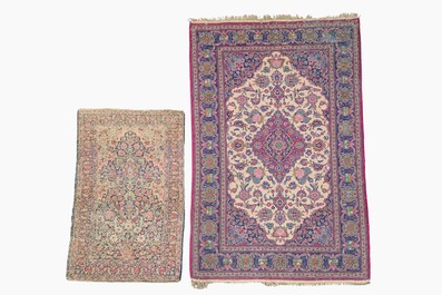 Two Persian rugs with floral design, Kashan and Kerman (Kirman), wool on cotton, 20th C.