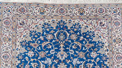 A Persian Nain rug with floral design, wool, cotton and silk, 20th C.