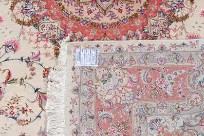 A Chinese Tabriz style rug with floral design, wool on silk, 20th C.