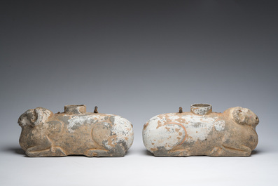 A pair of Chinese polychrome painted pottery ram-shaped vessels, Han dynasty
