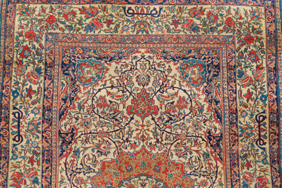 A Persian Isfahan rug with floral design, wool on cotton, 20th C.