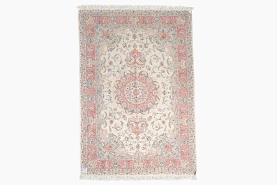 A Chinese Tabriz style rug with floral design, wool on silk, 20th C.