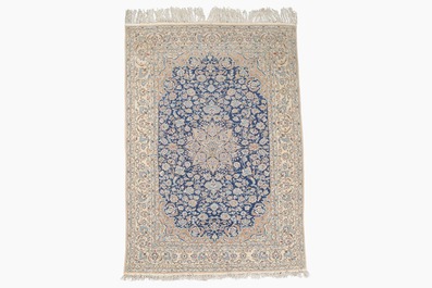 A Persian Nain rug with floral design, wool on cotton, 20th C.