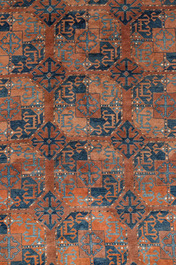 An Afghan rug with geometric design, wool on cotton, 20th C.