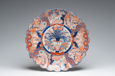 A Japanese blue and white Hirado vase with dragon relief design, an Imari vase and cover and a dish with floral design, Meiji, 19th/20th C.
