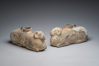A pair of Chinese polychrome painted pottery ram-shaped vessels, Han dynasty