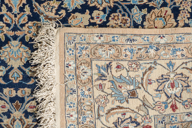 A Persian Nain rug with floral design, wool on cotton, 20th C.