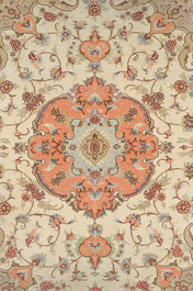 A Persian Tabriz rug with floral design, wool, cotton and silk, 20th C.