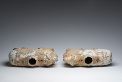 A pair of Chinese polychrome painted pottery ram-shaped vessels, Han dynasty