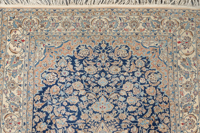 A Persian Nain rug with floral design, wool on cotton, 20th C.
