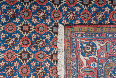 A Persian Varamin rug with floral design, wool on cotton, mid 20th C.