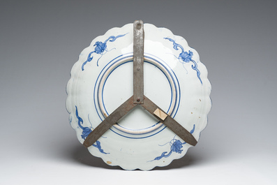 A Japanese blue and white Hirado vase with dragon relief design, an Imari vase and cover and a dish with floral design, Meiji, 19th/20th C.