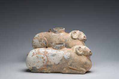 A pair of Chinese polychrome painted pottery ram-shaped vessels, Han dynasty