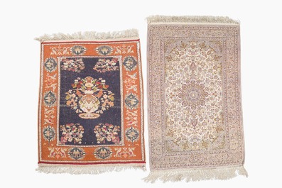 A Persian Isfahan rug and a Turkmen rug with floral design, wool, cotton and silk, 20th C.