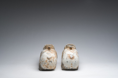 A pair of Chinese polychrome painted pottery ram-shaped vessels, Han dynasty