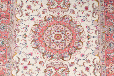 A Chinese Tabriz style rug with floral design, wool on silk, 20th C.