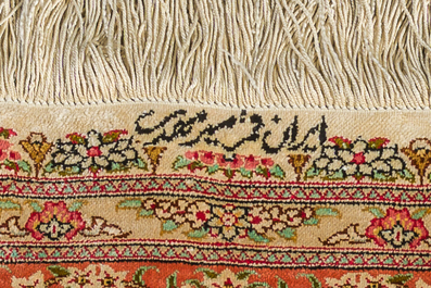 A Persian Qom (Qum/Ghom) silk rug with floral design, signed Mirmehdi, 20th C.