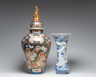 A Japanese blue and white Hirado vase with dragon relief design, an Imari vase and cover and a dish with floral design, Meiji, 19th/20th C.