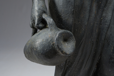 A patinated lead garden statue of a lady with water jugs in her hand, 19th/20th C.
