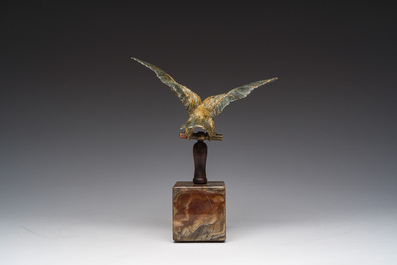 A Viennese polychrome cold painted bronze model of an eagle on a wooden and onyx marble base, 19th/20th C.