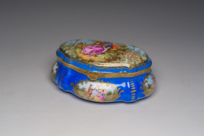 A French gilt and polychrome decorated jewelry box with amorous scenes and floral design, S&egrave;vres mark, 19th/20th C.