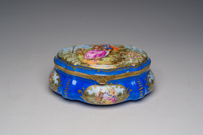 A French gilt and polychrome decorated jewelry box with amorous scenes and floral design, S&egrave;vres mark, 19th/20th C.