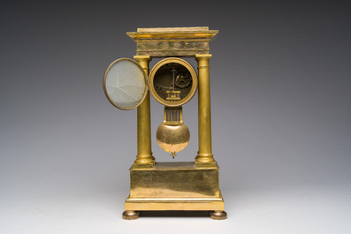 A French gilt bronze portico clock, 19th C.