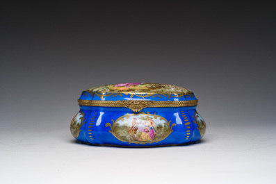A French gilt and polychrome decorated jewelry box with amorous scenes and floral design, S&egrave;vres mark, 19th/20th C.