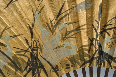 A large Japanese painted 'cranes in a landscape' folding fan luxuriously framed in a plexiglass box, signed, 20th C.