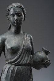 A patinated lead garden statue of a lady with water jugs in her hand, 19th/20th C.