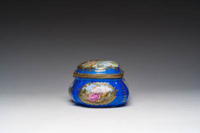 A French gilt and polychrome decorated jewelry box with amorous scenes and floral design, S&egrave;vres mark, 19th/20th C.