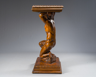 An Italian wooden console table in the shape of a kneeling man carrying a panel, second half 20th C.