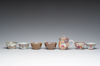 Six Chinese famille rose and gilt cups and saucers and a cream jug with floral and mandarin design, Yongzheng/Qianlong