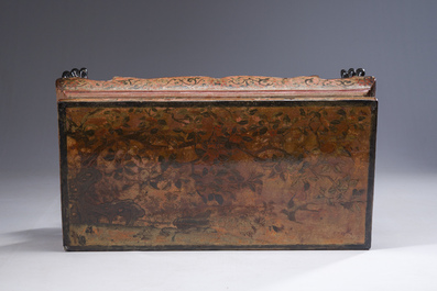 A Chinese rectangular carved and lacquered wooden low table with peach design, Qing