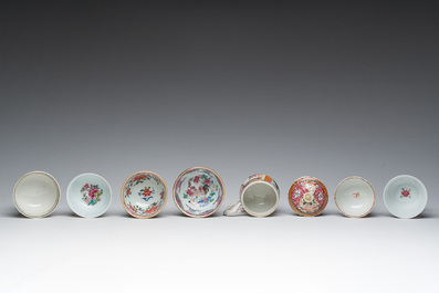 Six Chinese famille rose and gilt cups and saucers and a cream jug with floral and mandarin design, Yongzheng/Qianlong