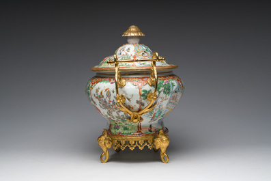 A Chinese Canton famille rose gilt mounted tureen and cover with animated scenes resting on four elephant heads, 19th C.