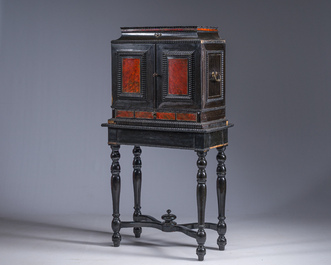 An ebonized wooden and tortoiseshell-veneered Antwerp cabinet on stand, 17th C. and later