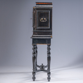 An ebonized wooden and tortoiseshell-veneered Antwerp cabinet on stand, 17th C. and later