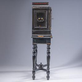 An ebonized wooden and tortoiseshell-veneered Antwerp cabinet on stand, 17th C. and later
