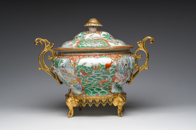 A Chinese Canton famille rose gilt mounted tureen and cover with animated scenes resting on four elephant heads, 19th C.