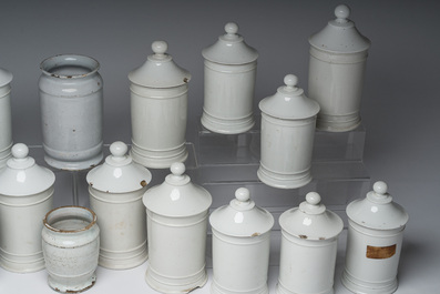 Two Dutch Delft blue and white and eighteen gilt and polychrome decorated porcelain pharmacy jars, 18th/19th C.