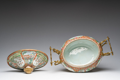 A Chinese Canton famille rose gilt mounted tureen and cover with animated scenes resting on four elephant heads, 19th C.