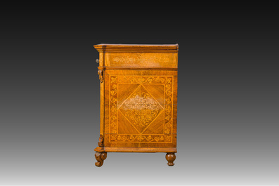 A North Italian commode with four drawers in mahogany and walnut with inlay of sphinxes and flowers in lemonwood, first third 19th C.