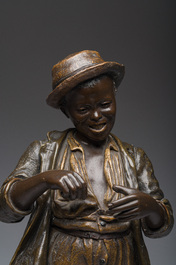 Cherc for Goldscheider (Hans Sch&ouml;rk (1849-1899), after): A polychrome decorated terracotta figure of a youth, Goldscheider mark, 20th C.