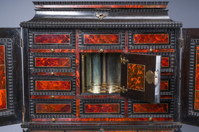 An ebonized wooden and tortoiseshell-veneered Antwerp cabinet on stand, 17th C. and later