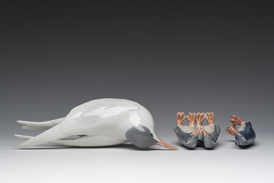 Three Danish Royal Copenhagen polychrome decorated porcelain models of an Arctic tern and penguins, 20th C.
