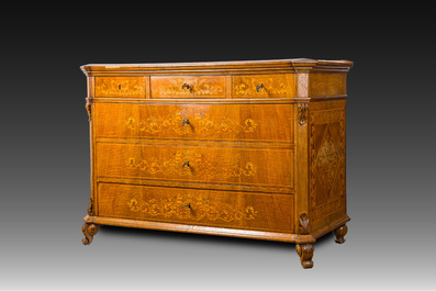A North Italian commode with four drawers in mahogany and walnut with inlay of sphinxes and flowers in lemonwood, first third 19th C.
